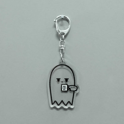 grumpy ghost transparent keychain holding coffee cup that says "have a nice day"